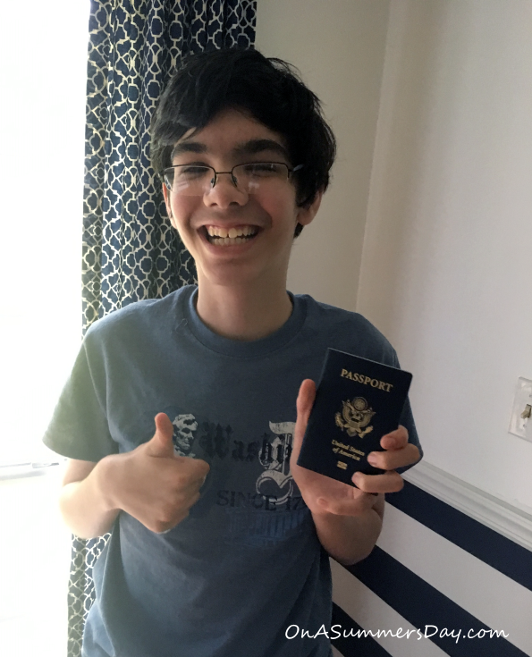 Teenage boy is holding a US Passport